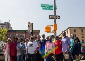 Group of people posing for a photo on a NYC street